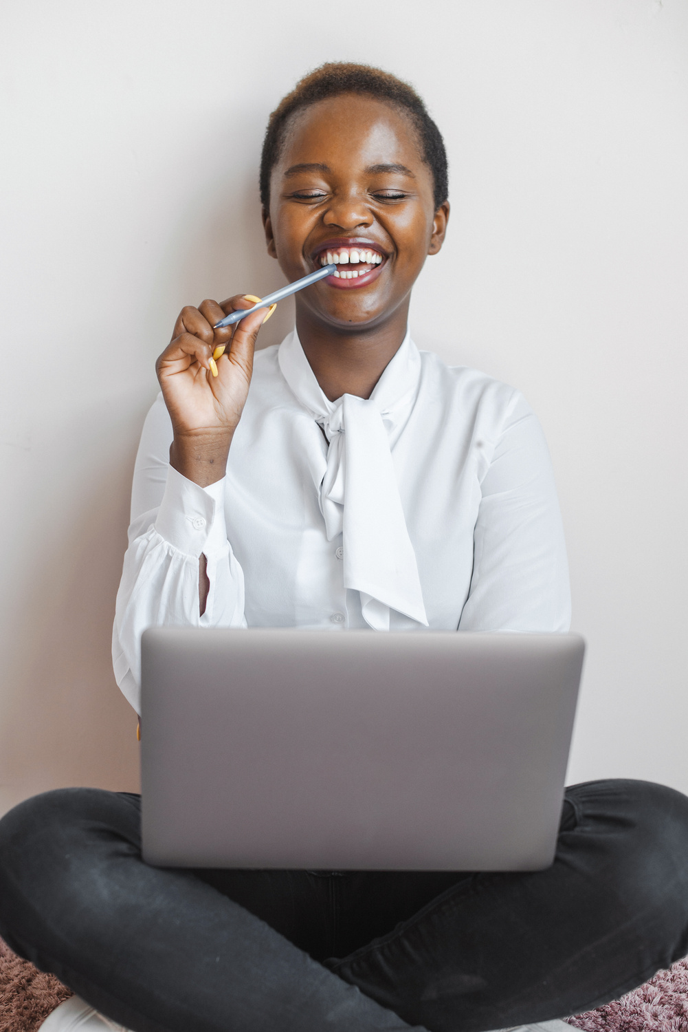 Beautiful afro woman smiling while attending an online conference. Online learning